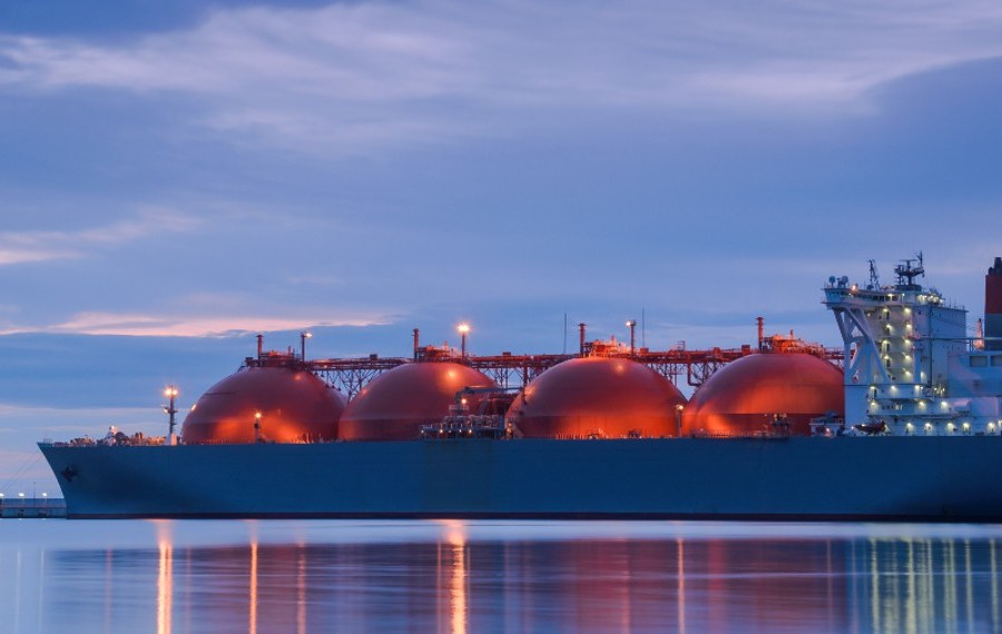 LNG tanker at twilight with lights