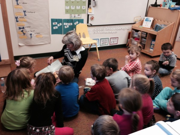 Williams employee Michelle reads "Pete the Cat" to students of McNinch Elementary School.