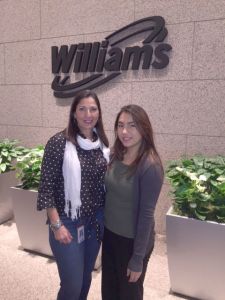 Maria Carlota Palacios and her intern Eloisa Cortinas pose in the lobby of our Houston tower. 