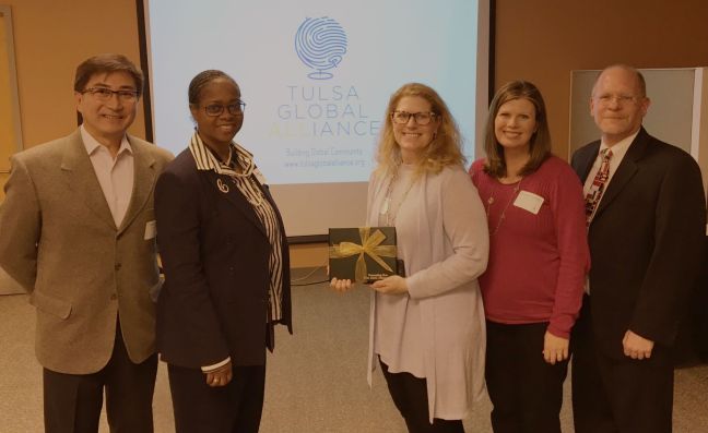 Accepting the award are TGA volunteers and Williams employees from left, Celso Kojima, Ceretha Terrell-Causey, Mary Frances Edmonds and Amethyst Cavallaro. Bob Leiser, vice president of program for the TGA, is on the right.