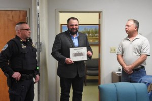 Photo courtesy of the Republican Herald used with permission. Tim Reed, center, is honored by Pine Grove Mayor Will Shiffer, right, and Pine Grove Police Chief Thomas Trotter, left.