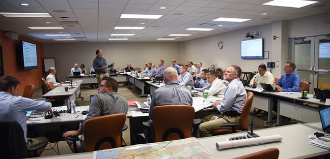 people sitting in a room during drill 