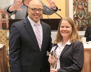 Dennis Kennedy, founder and chair, National Diversity Council, presents Cherie Humphries, vice president, Supply Chain, with a 2018 Top 50 Most Powerful Women in Oil and Gas award.