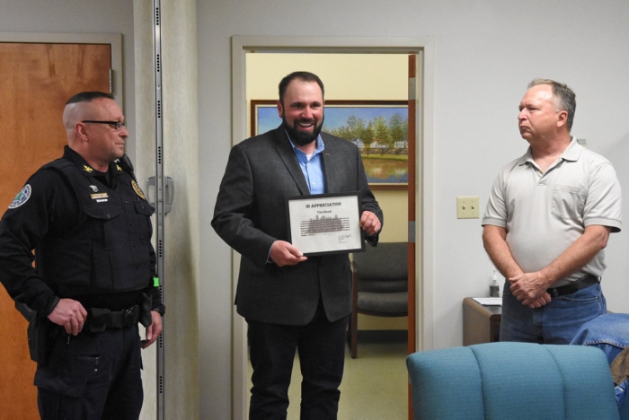 Photo courtesy of the Republican Herald used with permission. Tim Reed, center, is honored by Pine Grove Mayor Will Shiffer, right, and Pine Grove Police Chief Thomas Trotter, left.