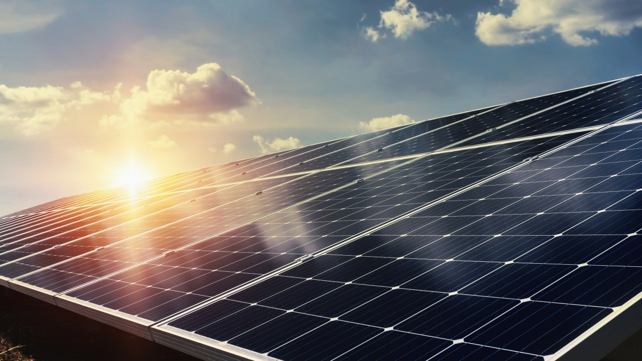 solar panel with sunlight and blue sky background. concept clean energy power in nature