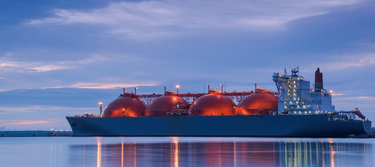 LNG tanker at twilight with lights
