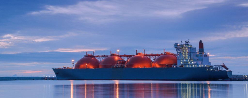 LNG tanker at twilight with lights